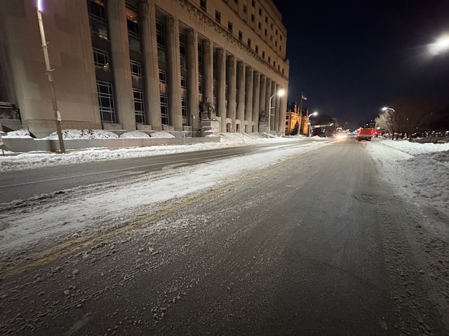 Nighttime snow removal on a downtown St. Louis street